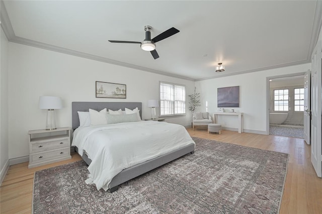 2650 NW 25th St, Oklahoma City, OK 73107 - bedroom with ornamental molding, multiple windows, light wood finished floors, and baseboards