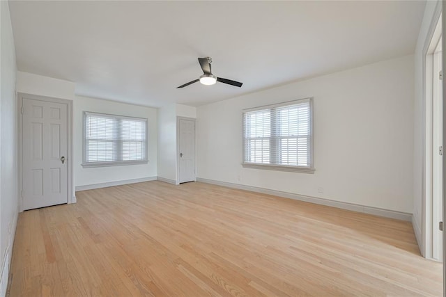 2650 NW 25th St, Oklahoma City, OK 73107 - unfurnished room featuring healthy amount of natural light, light wood-type flooring, a ceiling fan, and baseboards