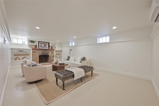 2650 NW 25th St, Oklahoma City, OK 73107 - living area with a wall unit AC, a fireplace, healthy amount of natural light, and recessed lighting