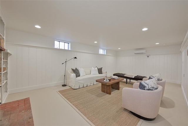 2650 NW 25th St, Oklahoma City, OK 73107 - living room with a wall unit AC, a decorative wall, recessed lighting, and a wainscoted wall