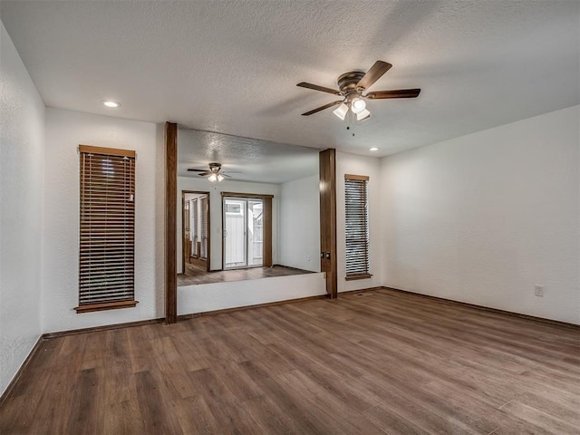 4400 Windsong Way, Oklahoma City, OK 73120 - empty room featuring ceiling fan, wood finished floors, baseboards, a textured ceiling, and recessed lighting