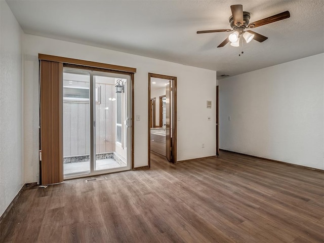 4400 Windsong Way, Oklahoma City, OK 73120 - spare room featuring wood finished floors, a ceiling fan, and baseboards