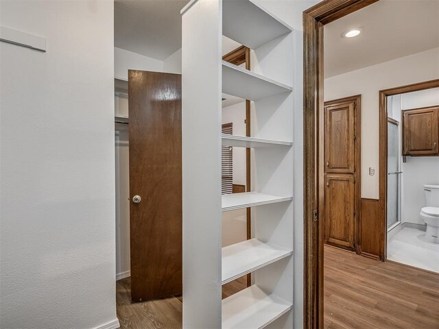 4400 Windsong Way, Oklahoma City, OK 73120 - walk in closet with wood finished floors
