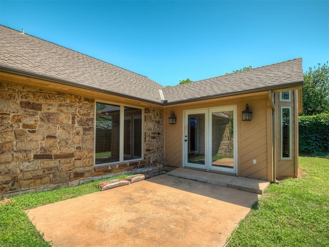 4400 Windsong Way, Oklahoma City, OK 73120 - doorway to property with a patio area, roof with shingles, and stone siding
