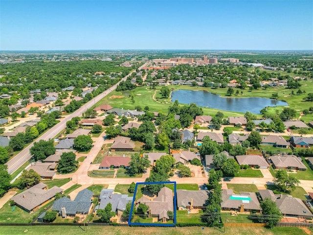 4400 Windsong Way, Oklahoma City, OK 73120 - aerial perspective of suburban area with property parcel outlined, a large body of water, and a golf club