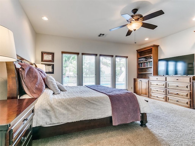 bedroom with multiple windows, carpet, recessed lighting, and a ceiling fan
