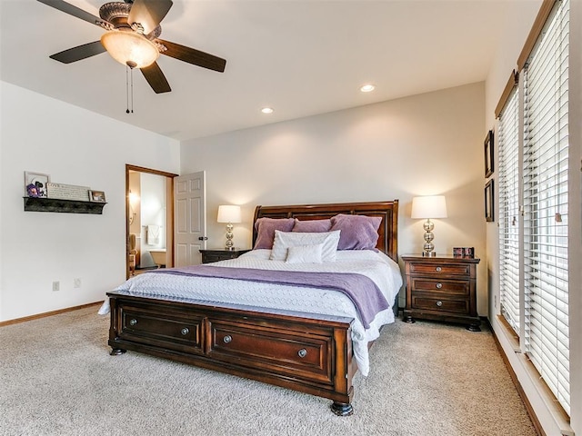 bedroom with light colored carpet, multiple windows, ceiling fan, baseboards, and recessed lighting