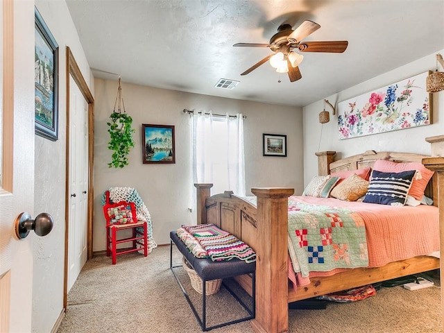 bedroom with light carpet, a ceiling fan, and baseboards