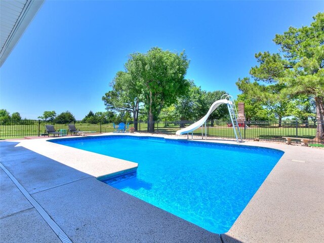 1486 County St Unit 2910 20, Acres Tuttle, OK 73089 - view of swimming pool with a water slide and a patio