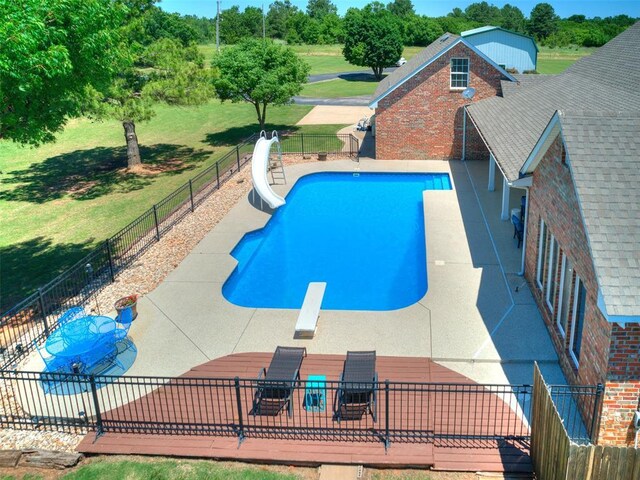 1486 County St Unit 2910 20, Acres Tuttle, OK 73089 - view of pool featuring a water slide, a diving board, and a patio area