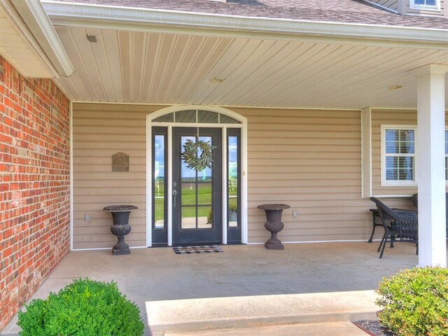 1486 County St Unit 2910 20, Acres Tuttle, OK 73089 - property entrance with roof with shingles and covered porch