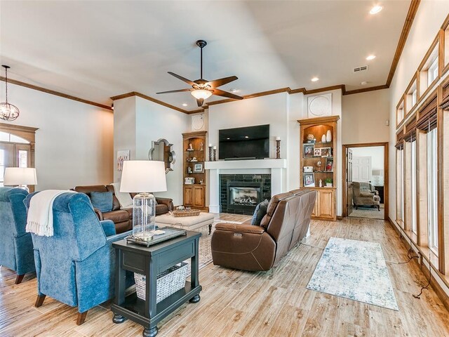 1486 County St Unit 2910 20, Acres Tuttle, OK 73089 - living area featuring ceiling fan, crown molding, light wood-style flooring, a fireplace, and recessed lighting