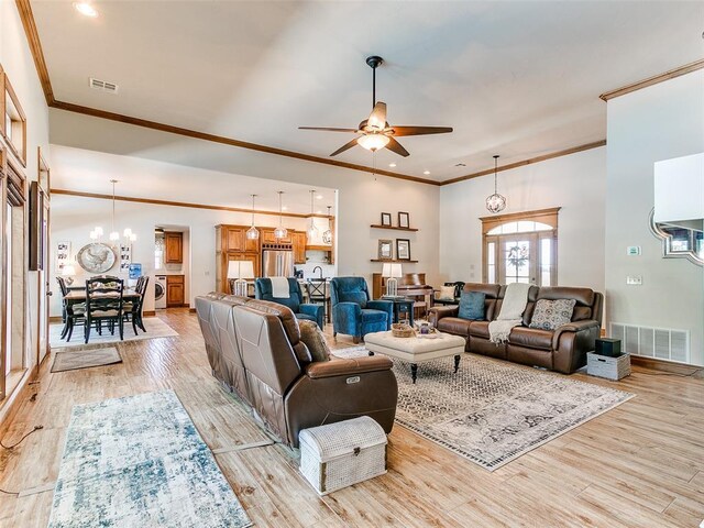 1486 County St Unit 2910 20, Acres Tuttle, OK 73089 - living area with crown molding, ceiling fan, a chandelier, light wood-style flooring, and recessed lighting