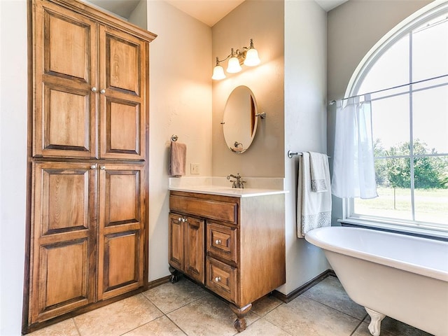 1486 County St Unit 2910 20, Acres Tuttle, OK 73089 - bathroom featuring vanity, a soaking tub, tile patterned floors, and baseboards