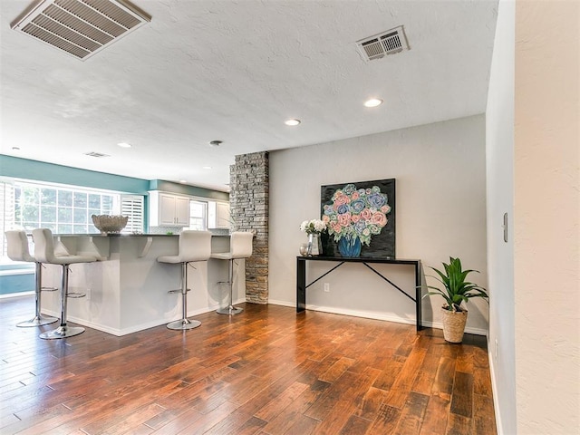 6709 Reed Dr, Oklahoma City, OK 73116 - bar area with dark wood-style floors, recessed lighting, plenty of natural light, and baseboards