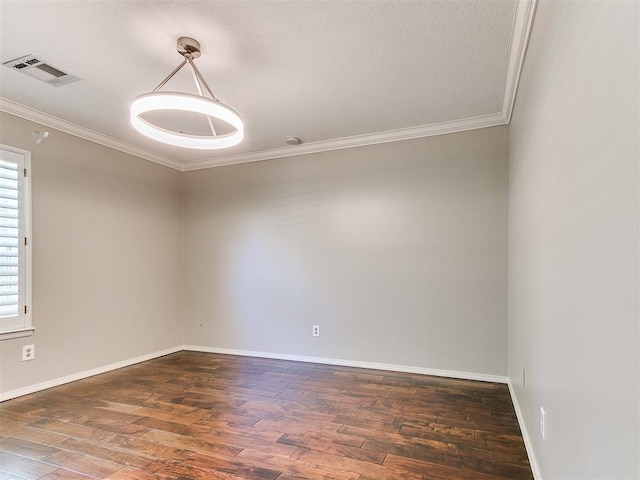 6709 Reed Dr, Oklahoma City, OK 73116 - spare room with crown molding, wood finished floors, and baseboards