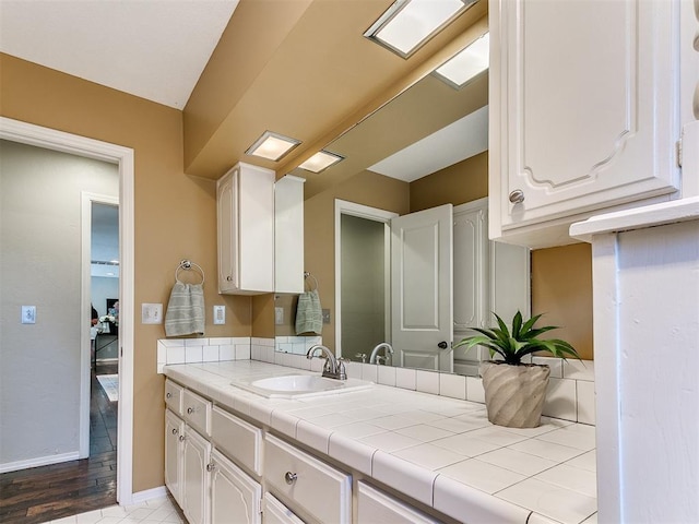 6709 Reed Dr, Oklahoma City, OK 73116 - bathroom with vanity and baseboards