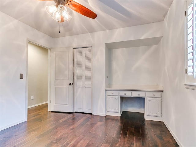 6709 Reed Dr, Oklahoma City, OK 73116 - unfurnished office with dark wood-type flooring, a ceiling fan, and baseboards