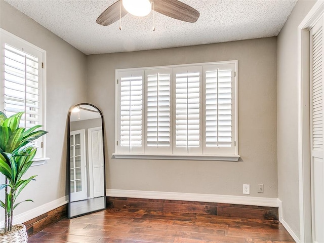 6709 Reed Dr, Oklahoma City, OK 73116 - unfurnished room featuring wood finished floors, ceiling fan, baseboards, and a textured ceiling