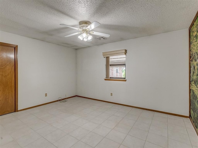 2915 N W Oaks Pl, Newcastle, OK 73065 - spare room with ceiling fan, a textured ceiling, and baseboards