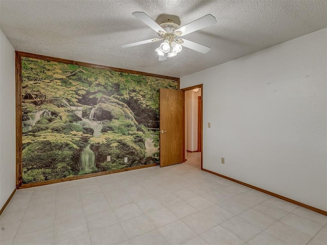 2915 N W Oaks Pl, Newcastle, OK 73065 - empty room featuring a textured ceiling, baseboards, ceiling fan, and light flooring