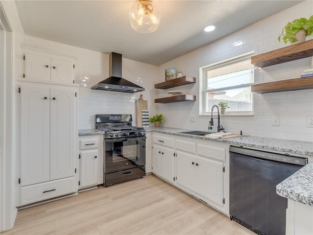 5613 NW 115th St, Oklahoma City, OK 73162 - kitchen featuring black range with gas cooktop, dishwashing machine, wall chimney range hood, a sink, and open shelves