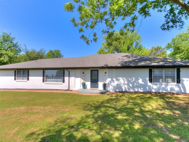 6501 N Laird Ave, Oklahoma City, OK 73105 - ranch-style house featuring a front yard and brick siding