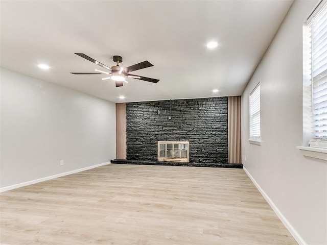 6501 N Laird Ave, Oklahoma City, OK 73105 - unfurnished living room featuring ceiling fan, a fireplace, plenty of natural light, wood finished floors, and recessed lighting