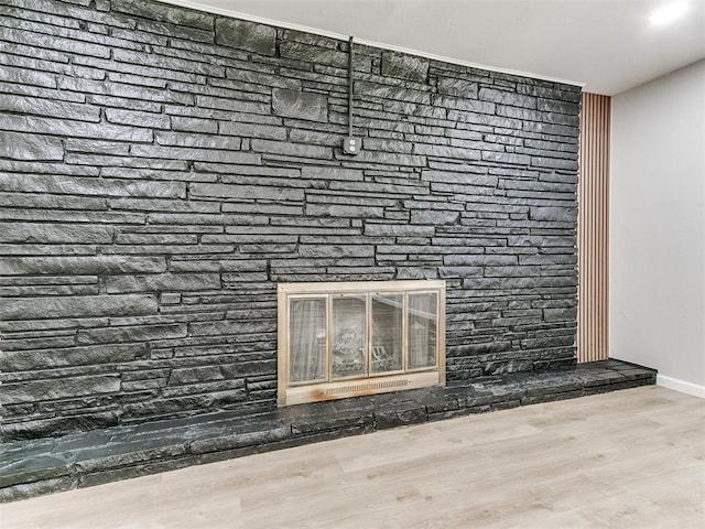 6501 N Laird Ave, Oklahoma City, OK 73105 - detailed view of a fireplace, wood finished floors, and baseboards