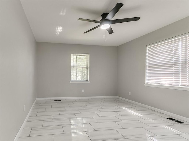 6501 N Laird Ave, Oklahoma City, OK 73105 - unfurnished room featuring ceiling fan and baseboards
