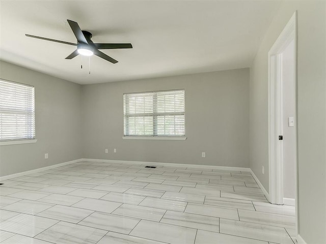 6501 N Laird Ave, Oklahoma City, OK 73105 - empty room with a ceiling fan and baseboards