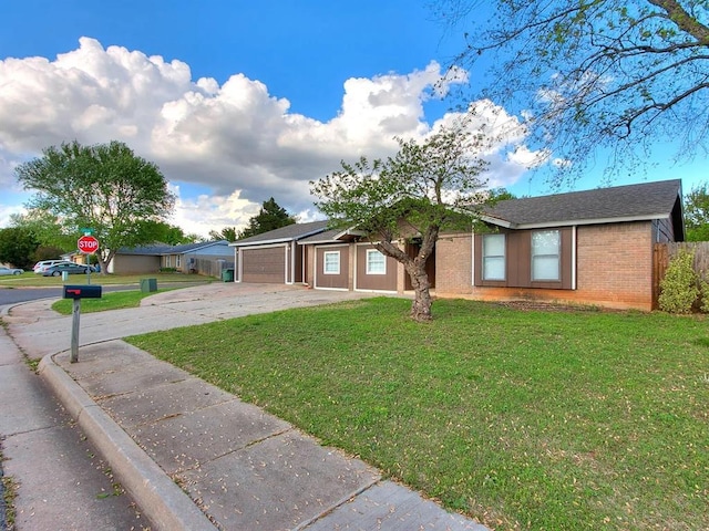 ranch-style house featuring concrete driveway, an attached garage, and brick siding
