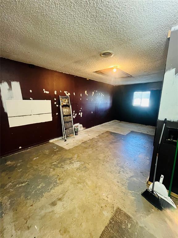 2217 7th St, Prague, OK 74864 - below grade area featuring a textured ceiling