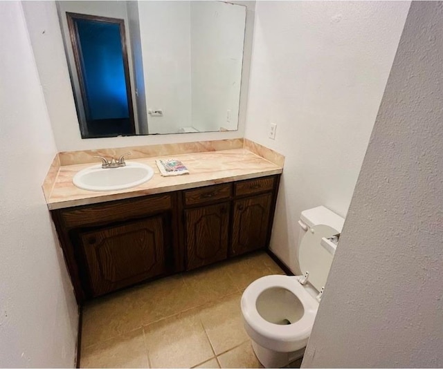 2217 7th St, Prague, OK 74864 - half bath with tile patterned floors, vanity, and toilet