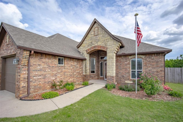 708 Carol Ann Pl, Moore, OK 73160 - french country home with a shingled roof, brick siding, and a garage