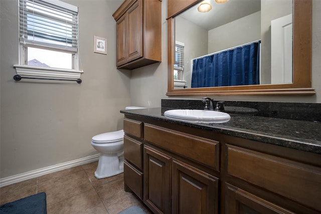 708 Carol Ann Pl, Moore, OK 73160 - bathroom featuring baseboards, toilet, tile patterned floors, and vanity