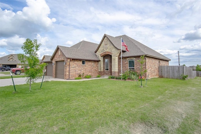 708 Carol Ann Pl, Moore, OK 73160 - french provincial home featuring a shingled roof, brick siding, a garage, and concrete driveway