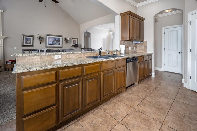 708 Carol Ann Pl, Moore, OK 73160 - kitchen featuring stainless steel dishwasher, arched walkways, a sink, a ceiling fan, and crown molding