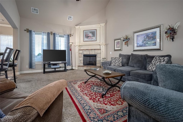 708 Carol Ann Pl, Moore, OK 73160 - living room featuring carpet flooring, baseboards, vaulted ceiling, and a fireplace