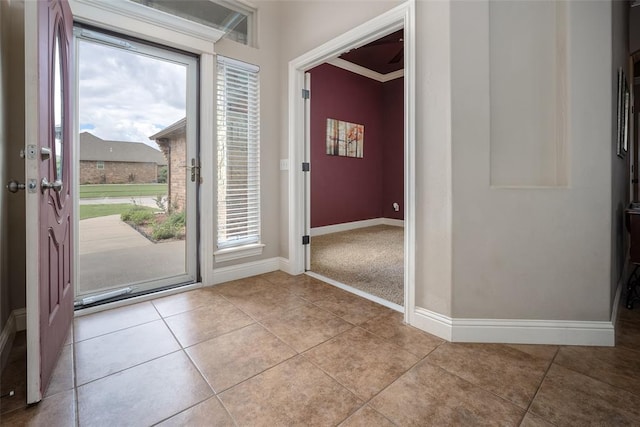 708 Carol Ann Pl, Moore, OK 73160 - entryway with healthy amount of natural light, baseboards, and tile patterned flooring