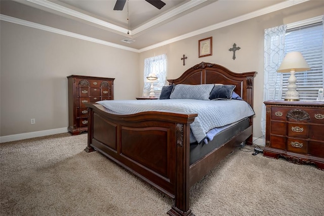 708 Carol Ann Pl, Moore, OK 73160 - bedroom featuring light carpet, a raised ceiling, crown molding, a ceiling fan, and baseboards