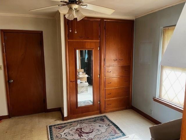 306 W Comanche St, Lindsay, OK 73052 - doorway to outside featuring light floors, ceiling fan, ornamental molding, and baseboards