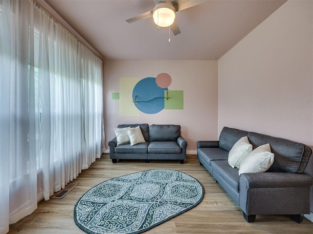 6401 Saddleback Dr, Oklahoma City, OK 73150 - living area featuring a ceiling fan, wood finished floors, and baseboards
