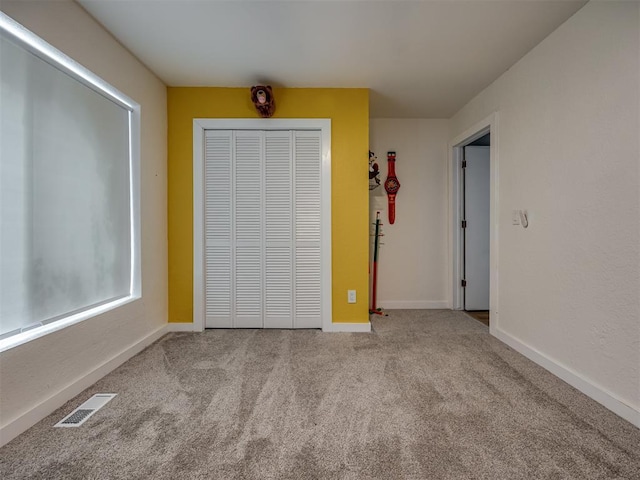 6401 Saddleback Dr, Oklahoma City, OK 73150 - unfurnished bedroom featuring carpet, a closet, and baseboards