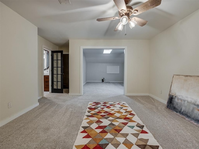 6401 Saddleback Dr, Oklahoma City, OK 73150 - living area featuring light carpet, ceiling fan, and baseboards