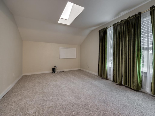 6401 Saddleback Dr, Oklahoma City, OK 73150 - additional living space with a skylight, lofted ceiling, carpet, and baseboards