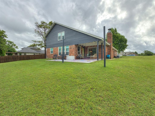 6401 Saddleback Dr, Oklahoma City, OK 73150 - back of house with a patio area, brick siding, and a chimney