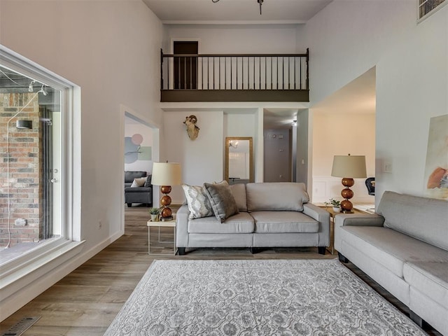 6401 Saddleback Dr, Oklahoma City, OK 73150 - living area featuring a high ceiling and wood finished floors