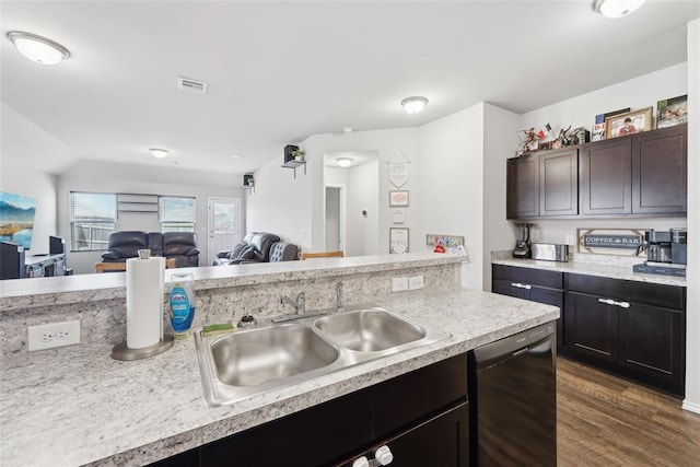 kitchen featuring black dishwasher, a sink, light countertops, dark wood-style floors, and dark brown cabinets