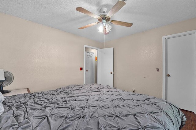 11402 N 1957th Rd, Elk City, OK 73644 - bedroom featuring wood finished floors and ceiling fan
